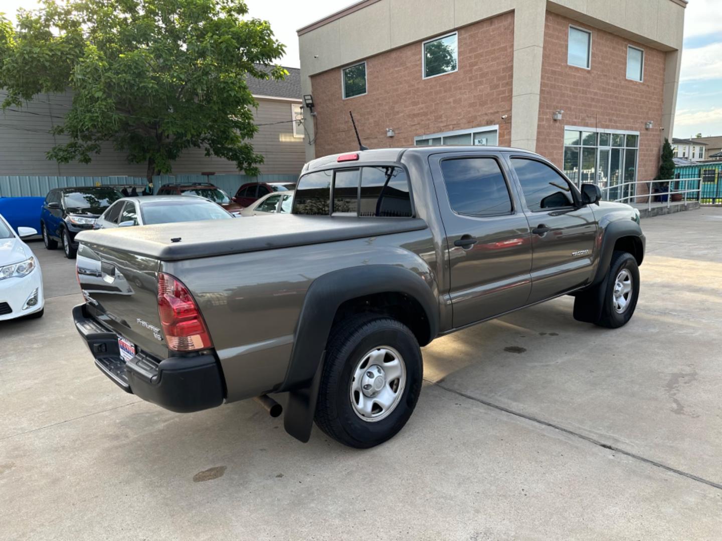 2012 Brown /Silver Toyota Tacoma SR5 (5TFJU4GN5CX) with an 4.0L engine, Automatic transmission, located at 1501 West 15th St., Houston, 77008, (713) 869-2925, 29.797941, -95.411789 - Photo#2